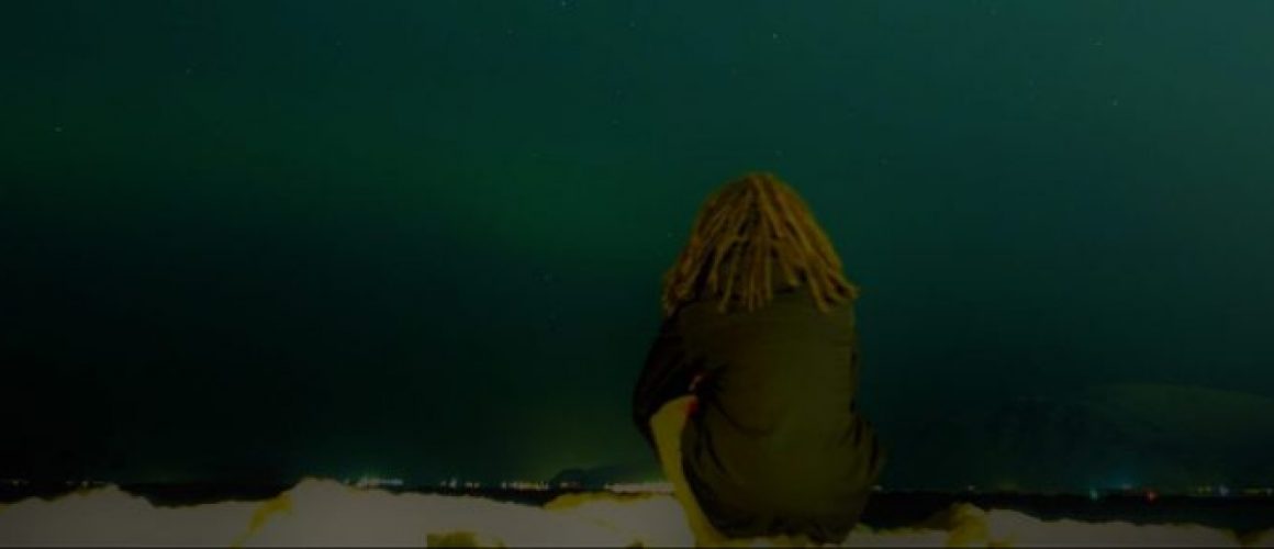 Oliver Parker and the Northern Lights by the Imagine Peace Tower